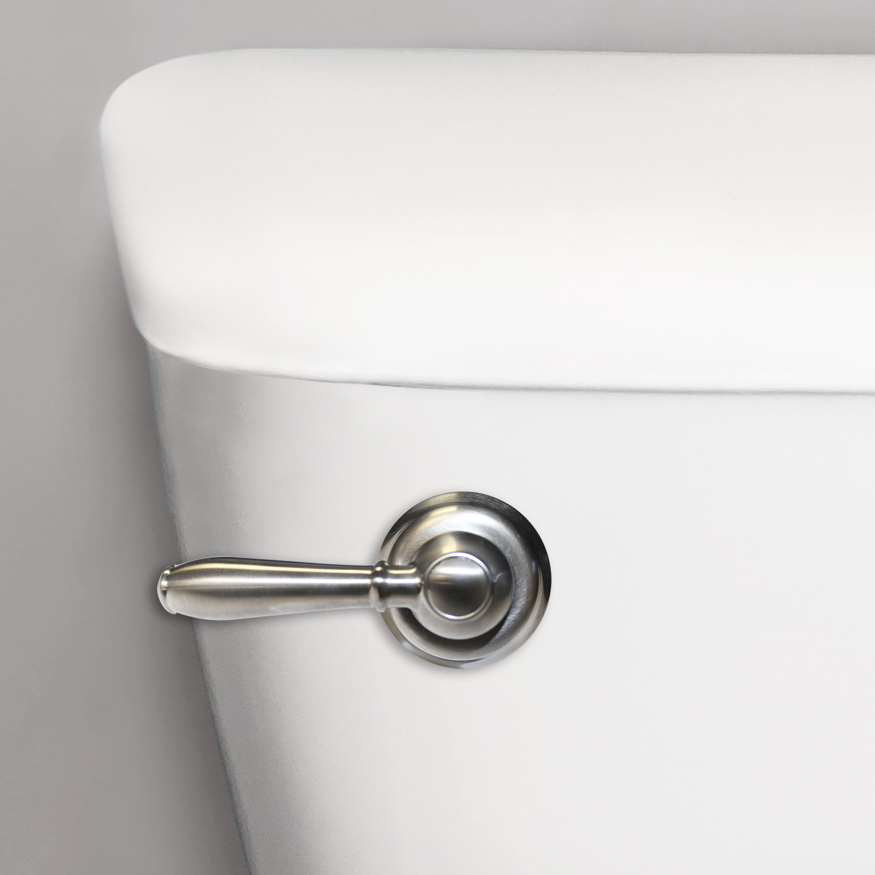 Korky faucet brushed nickel flush handle on a toilet tank