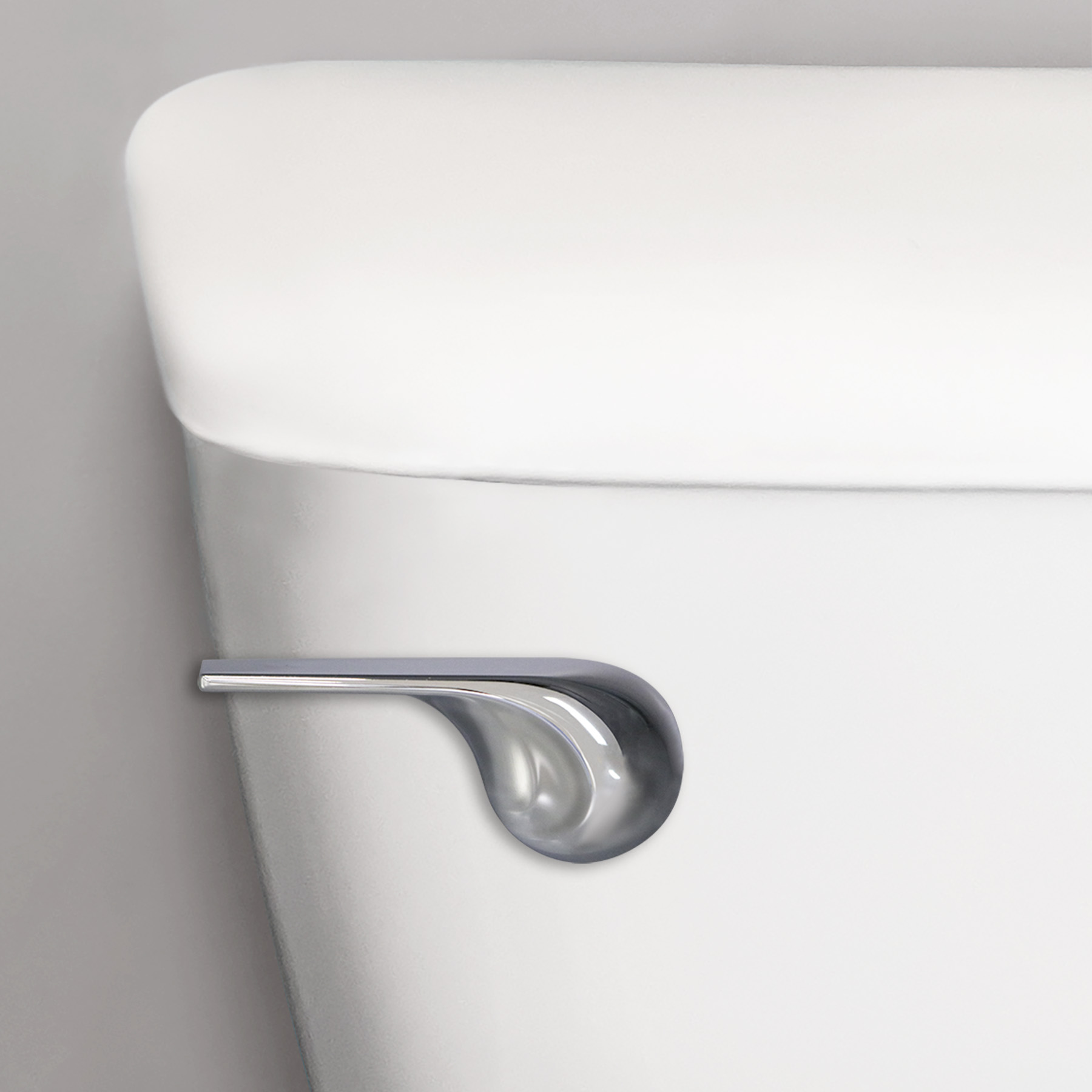 Wave style chrome toilet handle on toilet tank