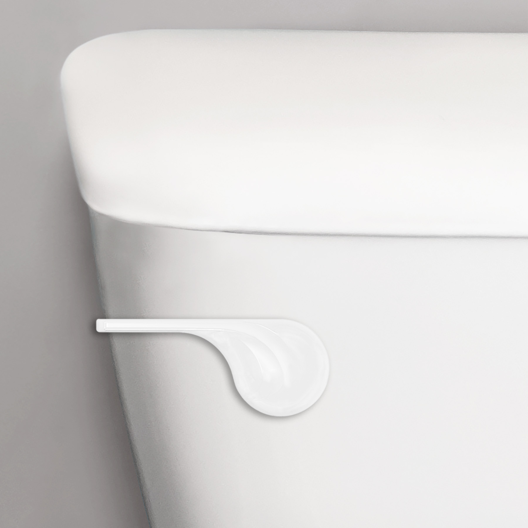 White wave style toilet handle closeup on a toilet tank