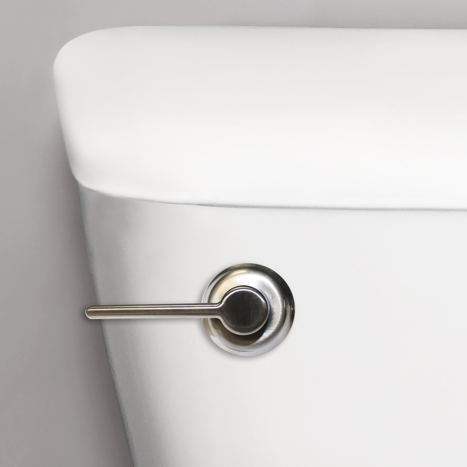 Classic chrome toilet handle shown close up on a toilet tank