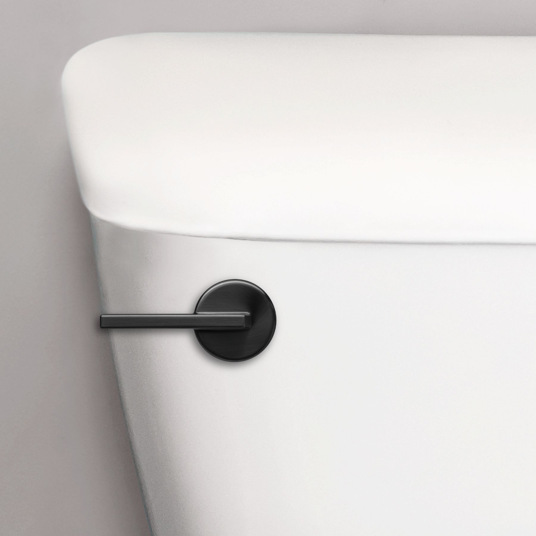 matte black contemporary toilet handle on a toilet tank