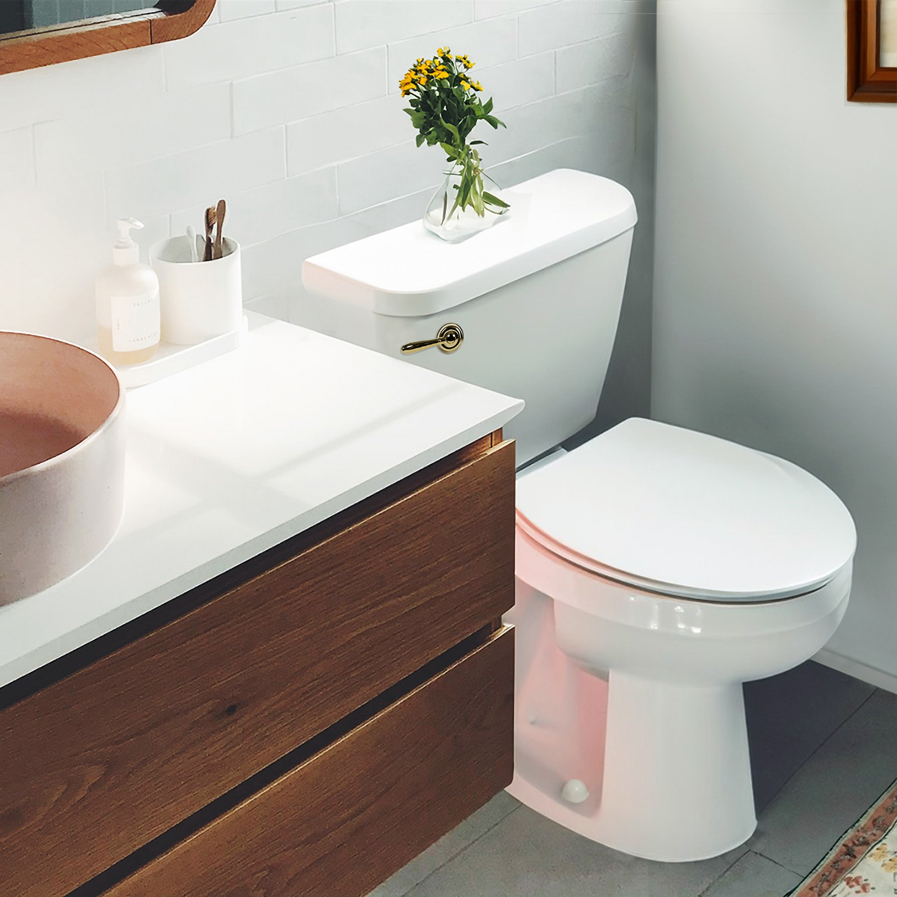 polished gold toilet handle in bathroom 